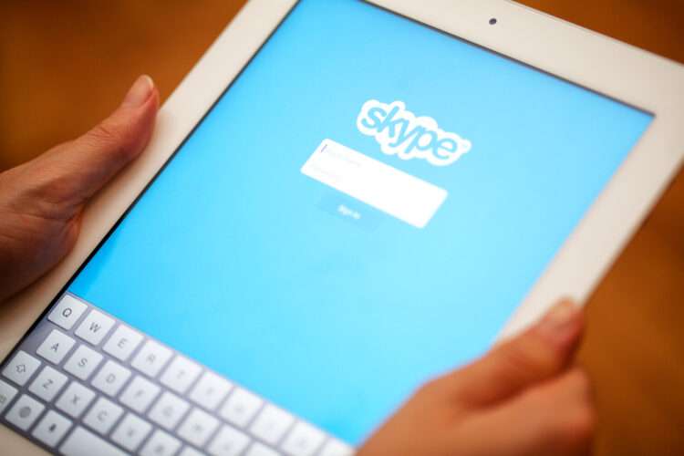 Milan, Italy - October 29, 2012: Skype application displayed on an tablet. Apple iPad 3. Facebook is the largest social media network on the web.